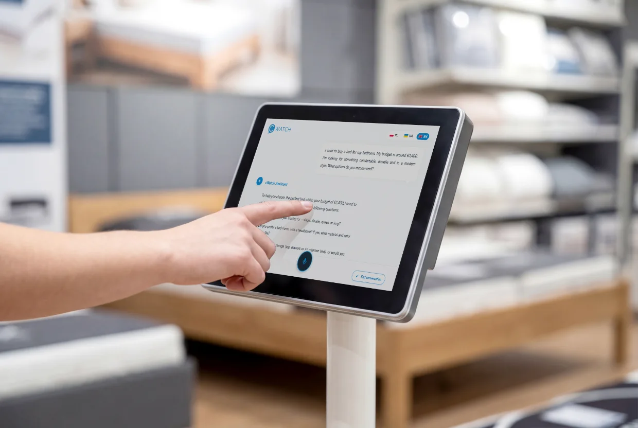 Close-up of a hand using the cWatch AI assistant on a tablet screen
